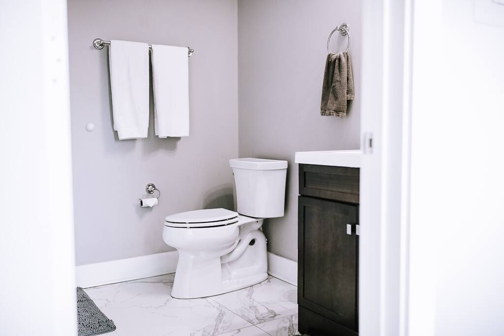 Full bathroom with a tiled, walk-in shower.