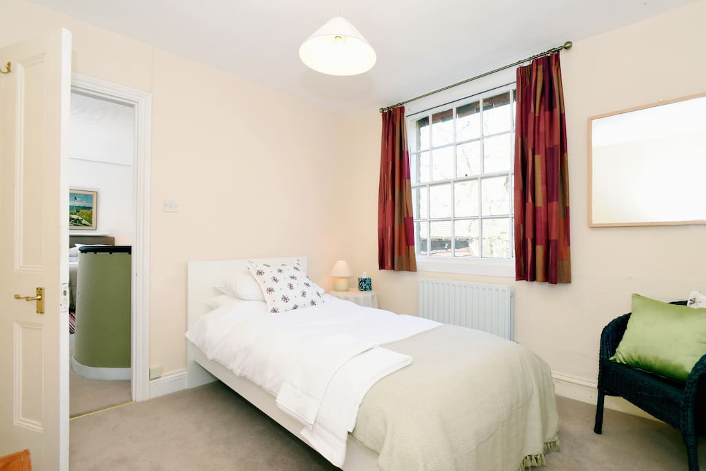 single bedroom looking through to sitting/bedroom