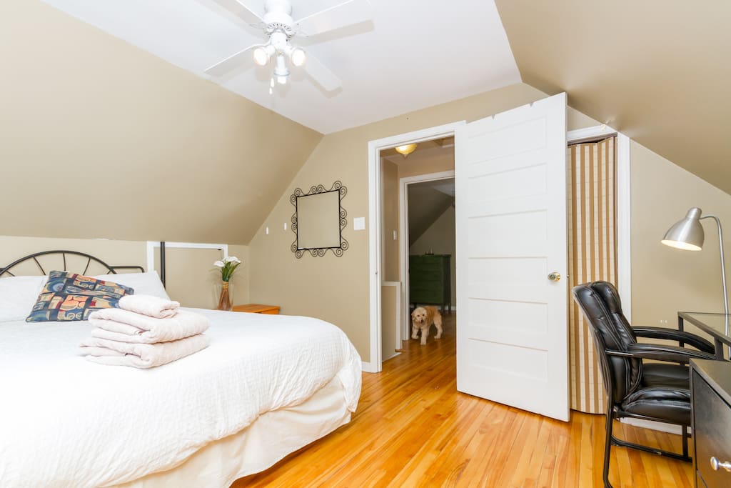 Comfortable bed, with a closet, desk, large dresser, ironing board and iron shared with the other room.