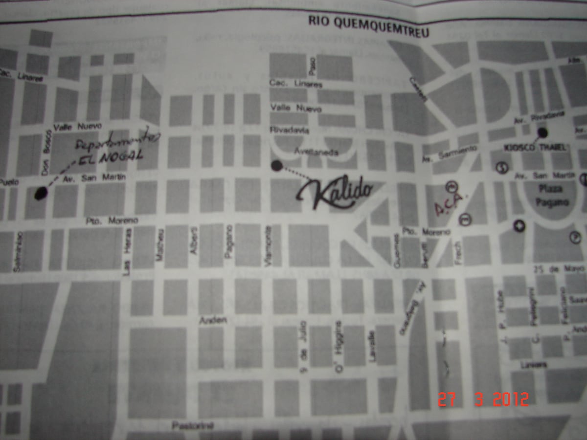 A printed map of a city layout is displayed, featuring street names and marked points of interest. The map is predominantly in black and white, with hand-drawn annotations indicating specific locations. The date '27 3 2012' is printed at the bottom right corner.
