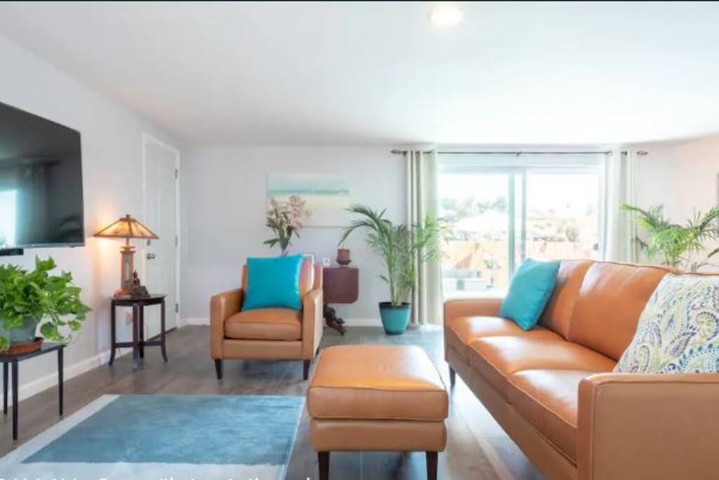 Relax in the Main Living Room with views to the pool.