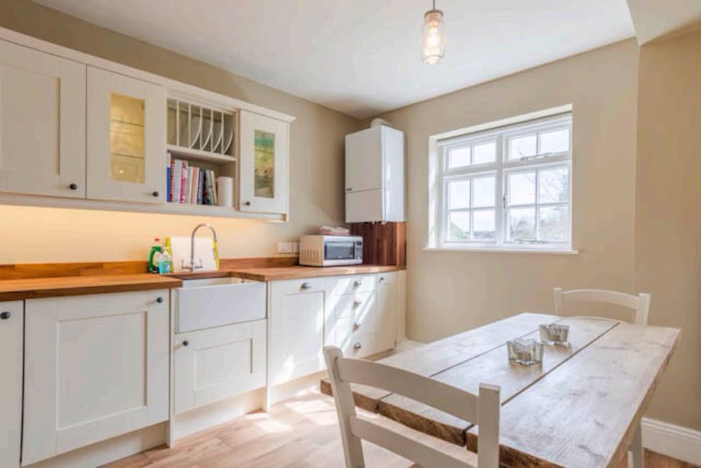 Large, new fitted kitchen/diner. Lots of cupboard space, Smeg oven and hob, dishwasher, washer/dryer, microwave and Belfast sink.