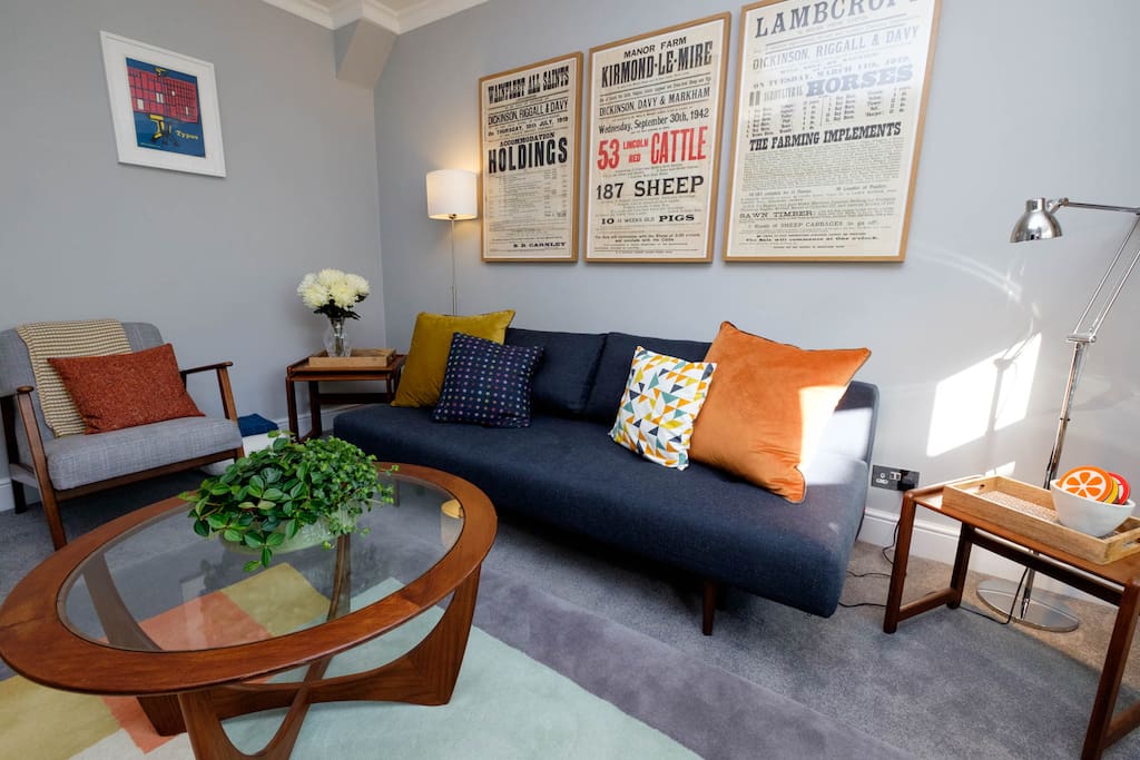 The living room has a double sofa bed