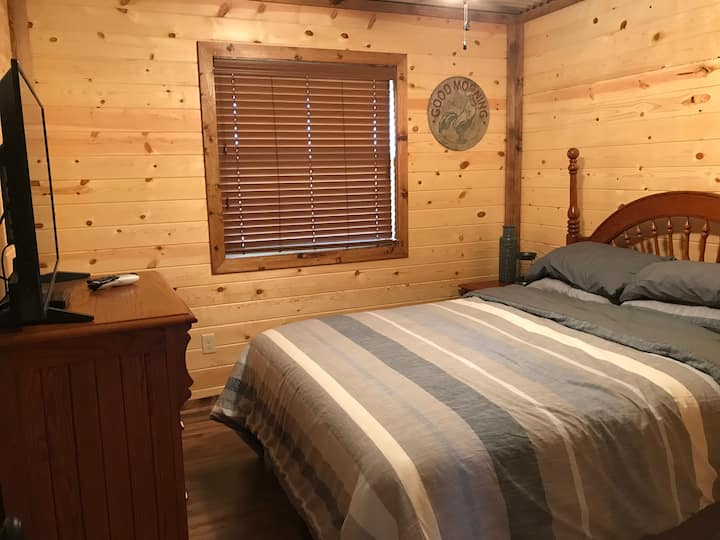 Queen size bed in bedroom two. 