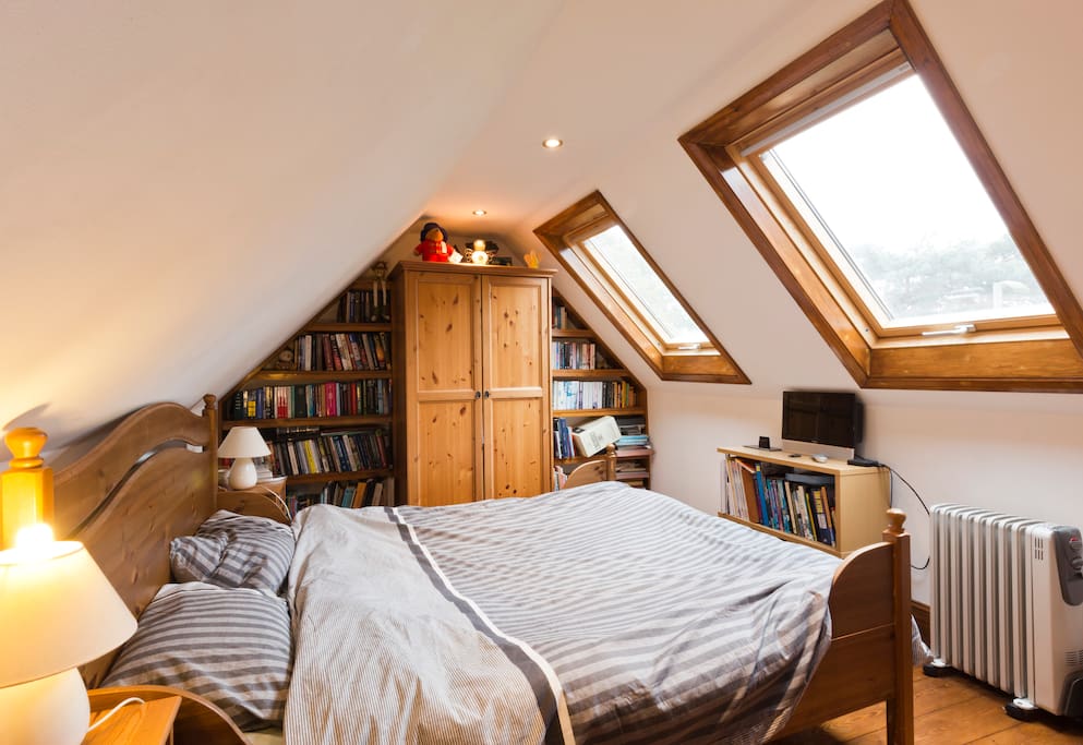 Master bedroom overlooking Sandown Park race course. King size bed.