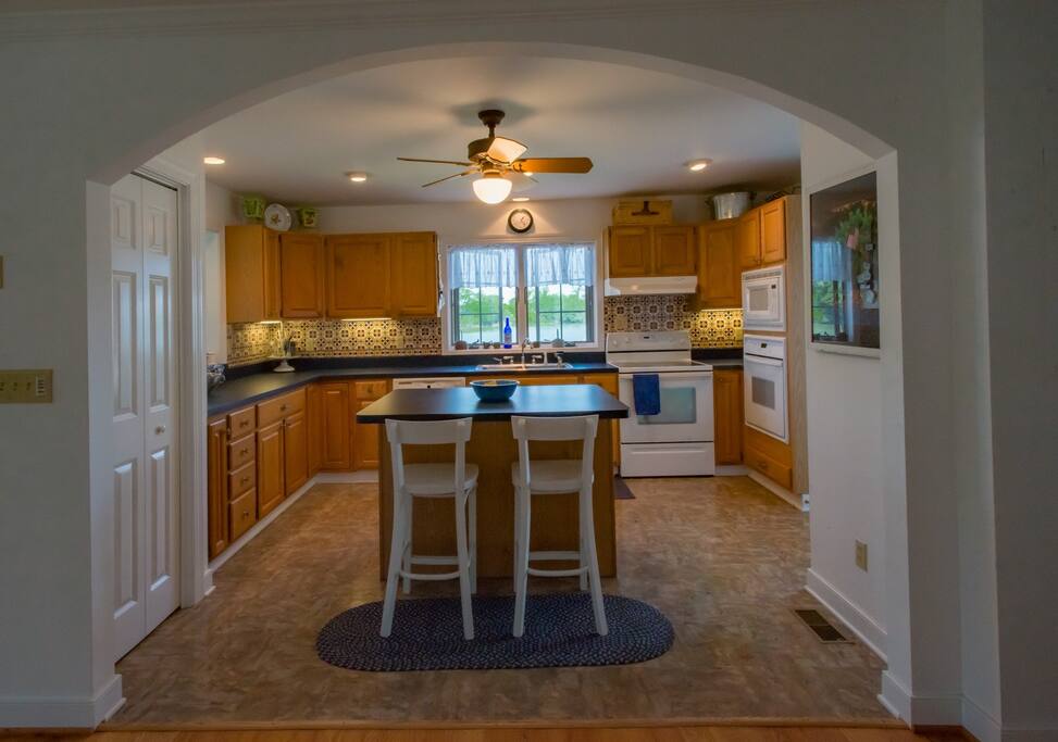 Eat at either of the two counters in the kitchen.