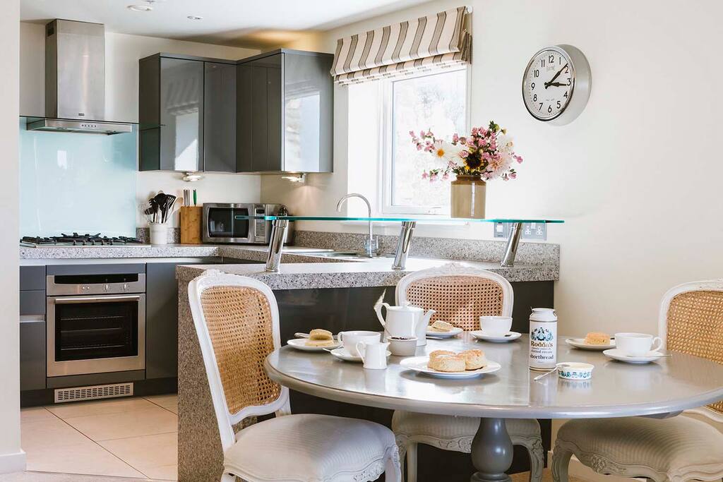 Open plan dining and kitchen area with all the mod cons you might need during your stay