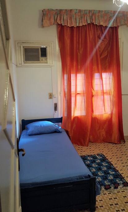 Room 2 with single bed and wardrobe