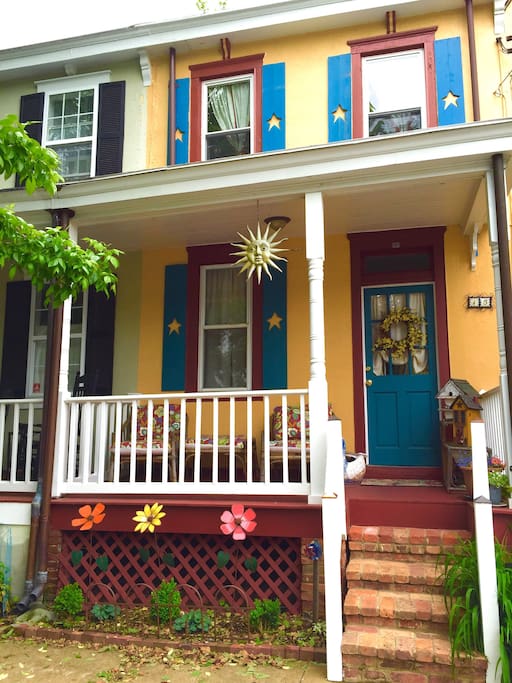Charming house with great front porch and chairs.