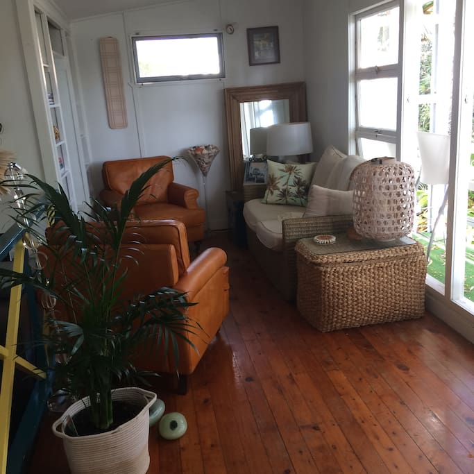 The lounge room. Tropical and beachy. TV for your use. WIFI also.
