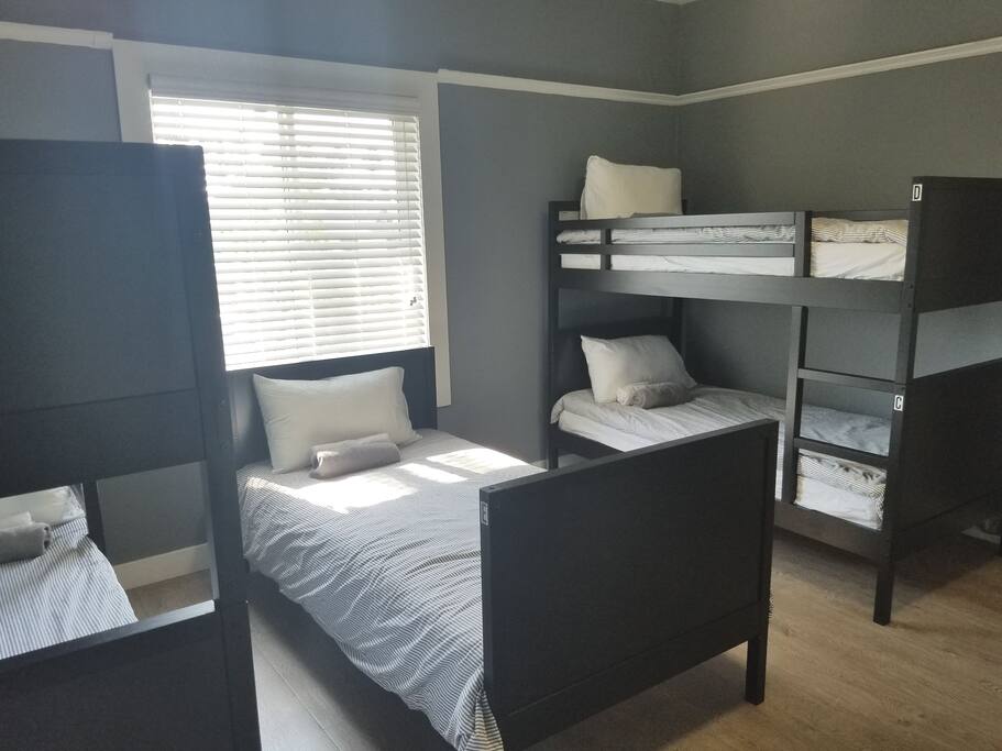 Room 7
* 5 comfortable beds for a group of traveling friends or a weekend with the family.
*Large closet for luggage storage *Private bathroom
* Large kitchen
*Free AC
*Free Private parking
*Laundry onsite
*Picnic table on front yard available