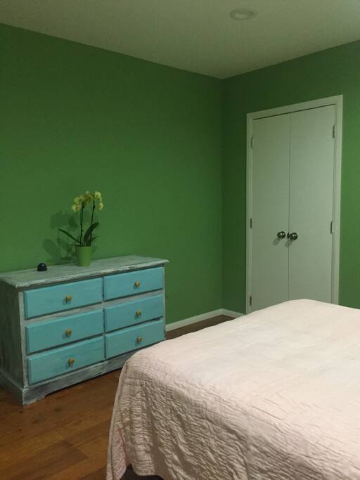 Private bedroom with full-sized bed and AC.