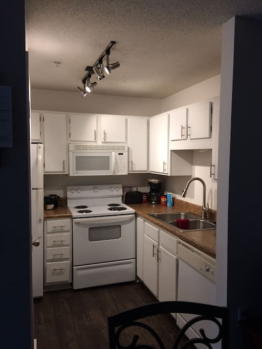 Kitchen with waffle maker, griddle, coffee maker and television