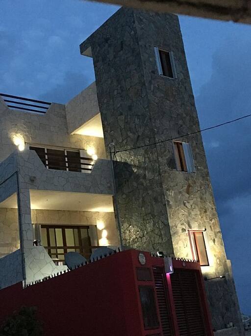 The house glows at night with the dusk to dawn custom carved music lights