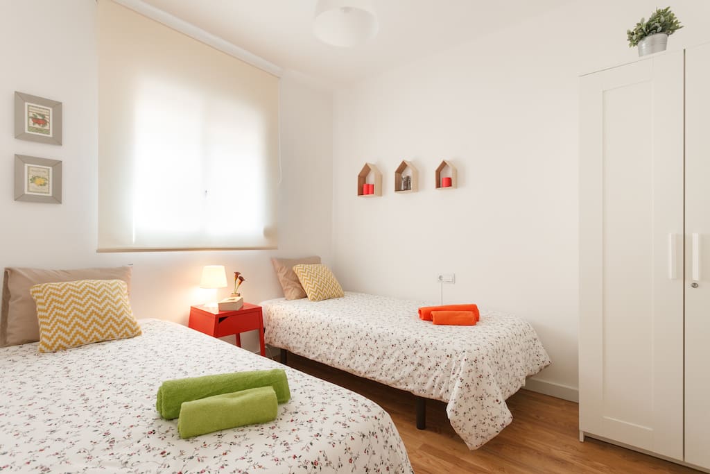 Two single beds in a double room