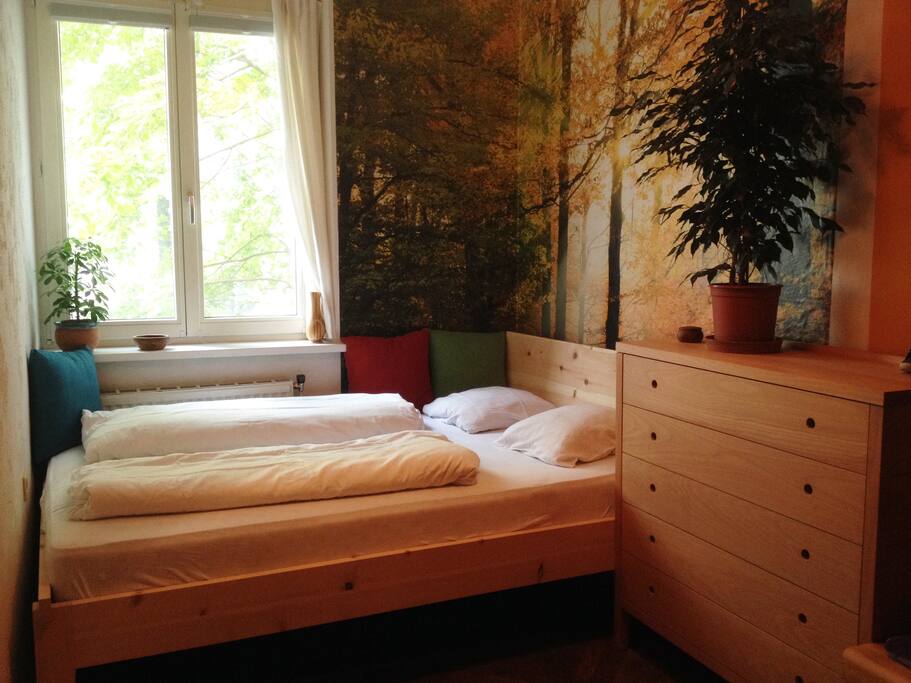 The bed with blankets and pillows
