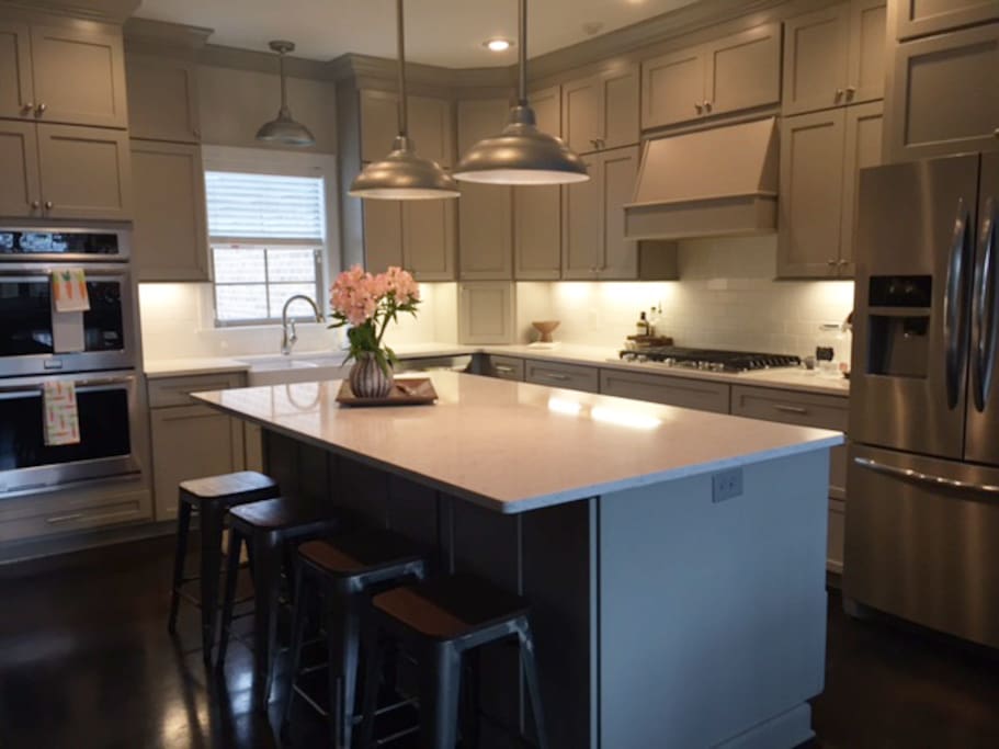 Spacious kitchen provides double ovens, gas stove and Keurig for guests.