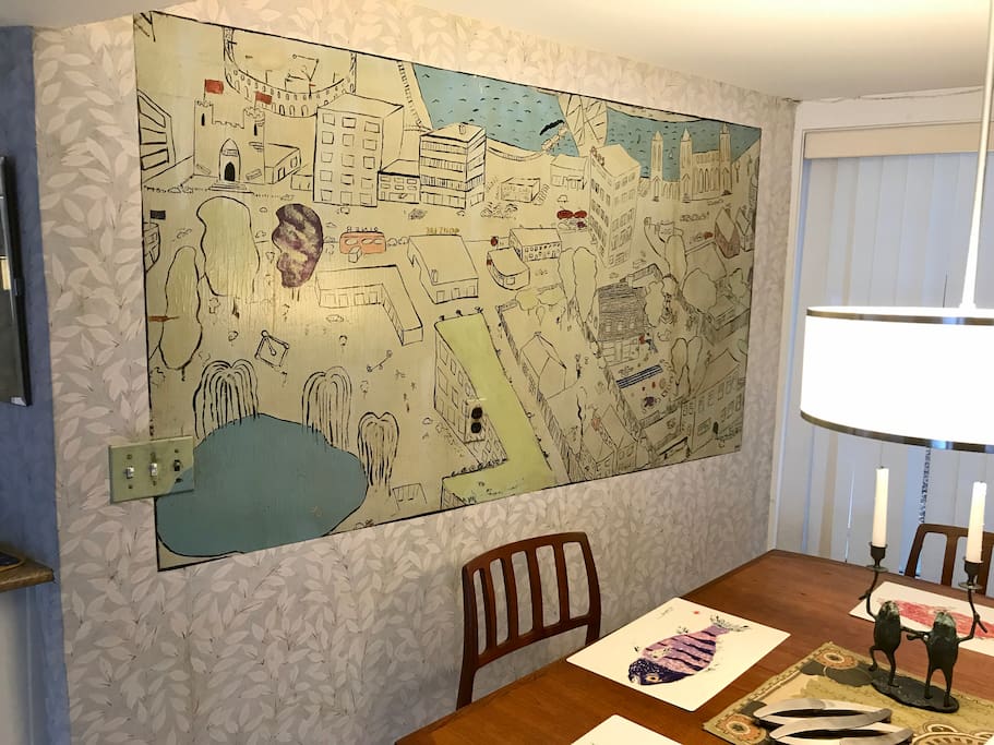 The hand painted mural map of the neighborhood is on the dining wall