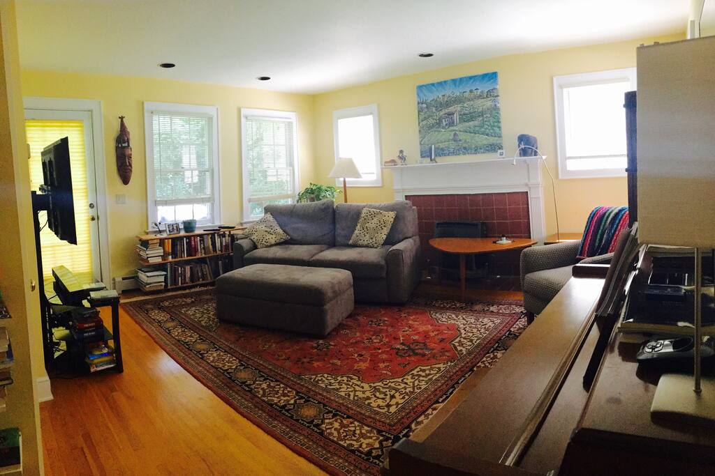 Family Room connecting to dining room and backyard, sofa bed