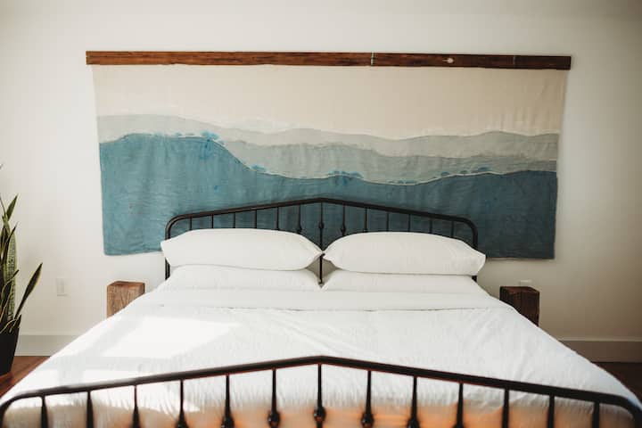 Bedroom 2 includes an area for hanging up clothes, hangers, bench, smart TV-Netflix included. 