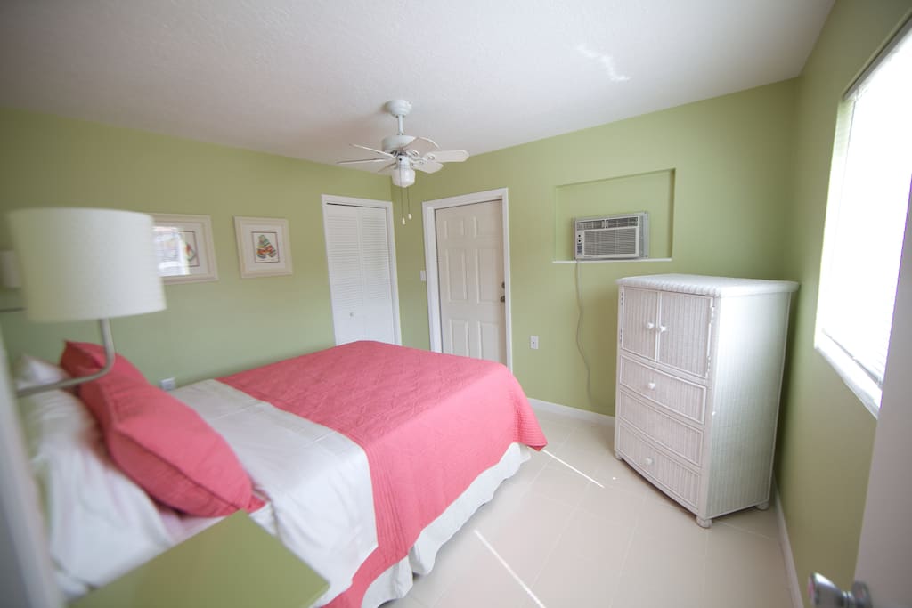 "Sandy Toes" bedroom has a queen bed, TV in cabinet