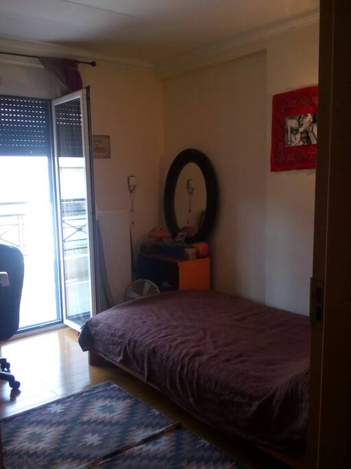 Room A2: bed and small office with balcony.