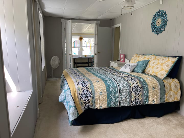 Master bedroom with queen bed opens to sun porch. Freshly remodeled. 