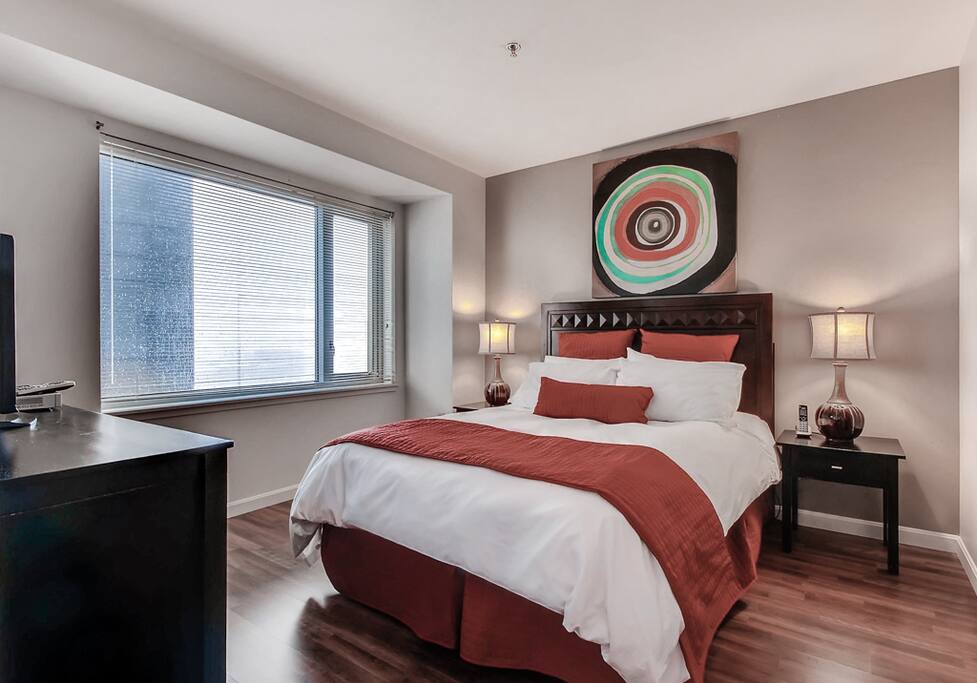 Master bedroom with en-suite bathroom, queen size bed and walk-in closet