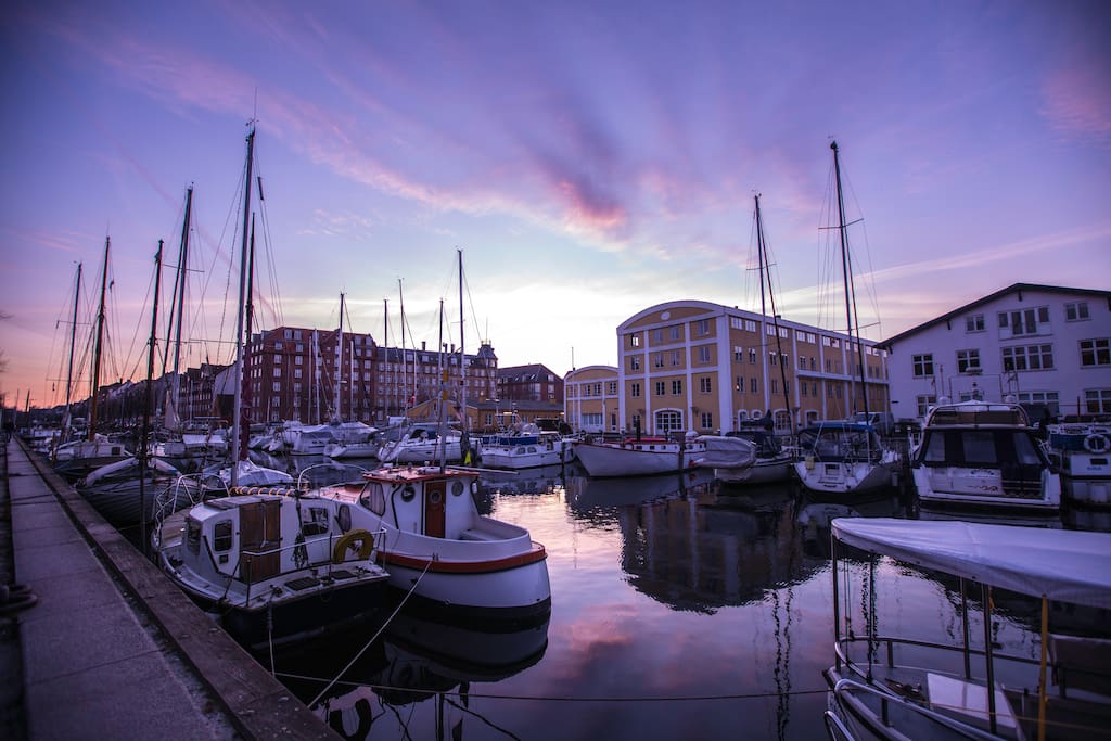 Enjoy a glass of wine on one of the benches by the canal