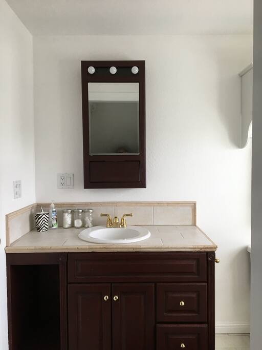Private bath includes shower (not shown)
and cherry wood vanity