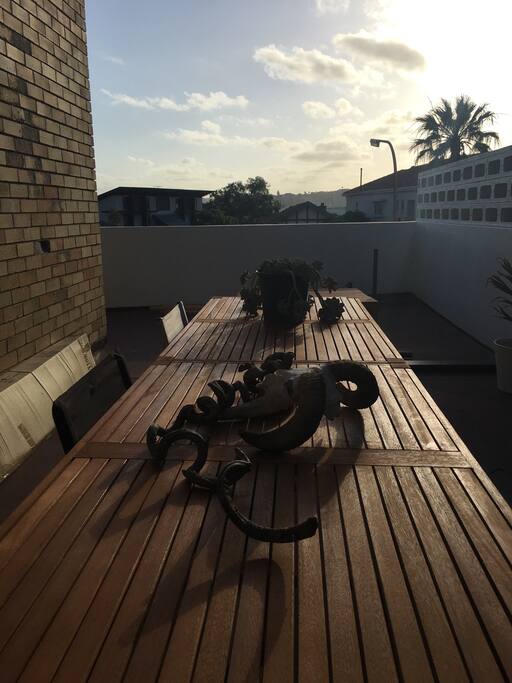 Private side deck with dining tables (seats 10) and bbq