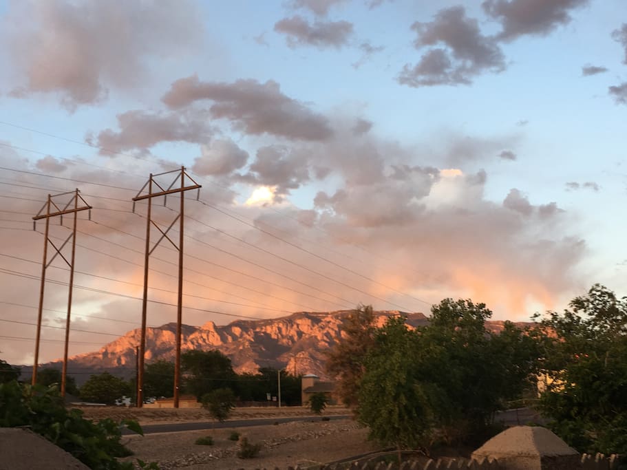 Beautiful sunset makes Sandia Mountains watermelon color.