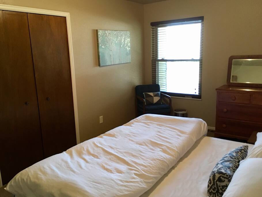 King Bedroom with memory foam mattress, down pillows, closet and dresser