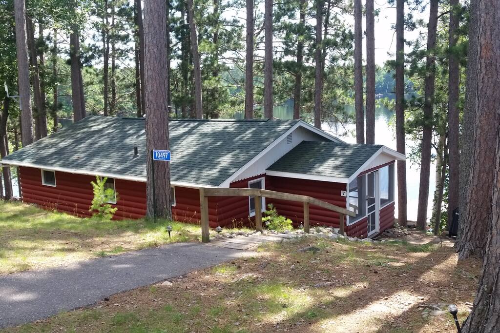 Walkway to entrance of cabin, fire pit & Weber Q grill just of picture right of the screen porch.
