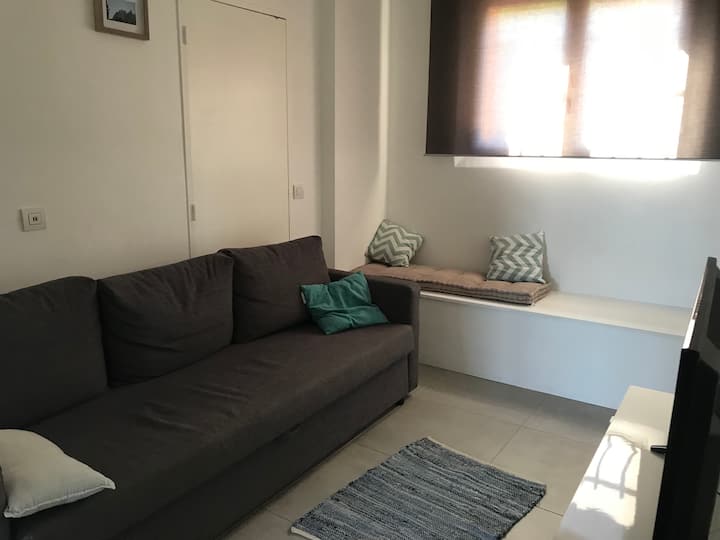 Living room-TV with sofa bed 140 by 200 cm with a TV