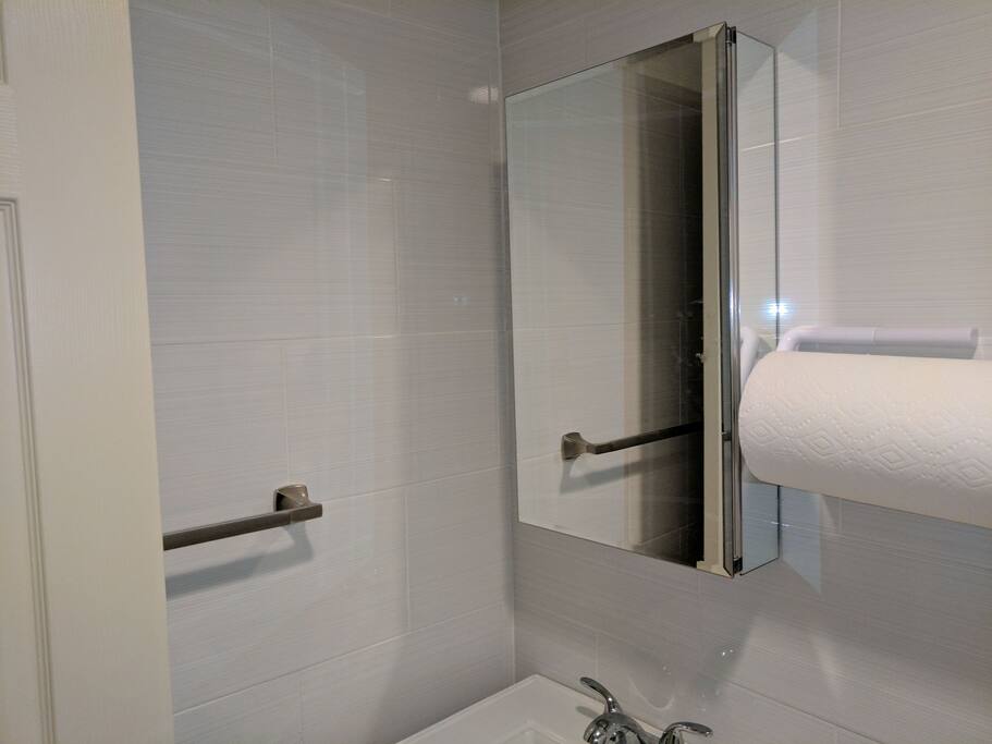 Shared bathroom with large whirltub