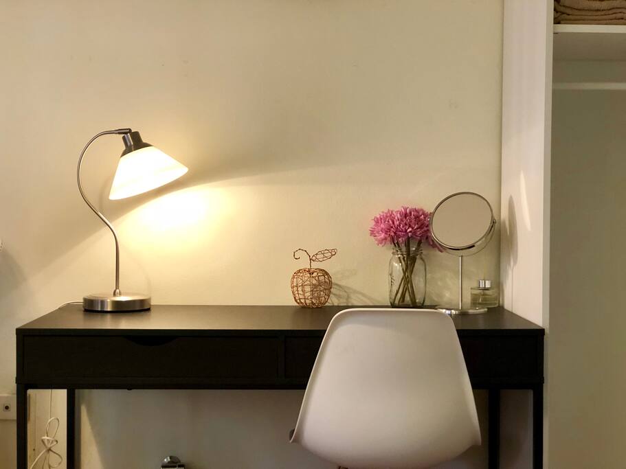 A large sized writing desk with easy access to power points should you need to charge your laptop while working. The extra space on the desk is great for a professional who likes to get some work done. (King + Sofa Bed Room)