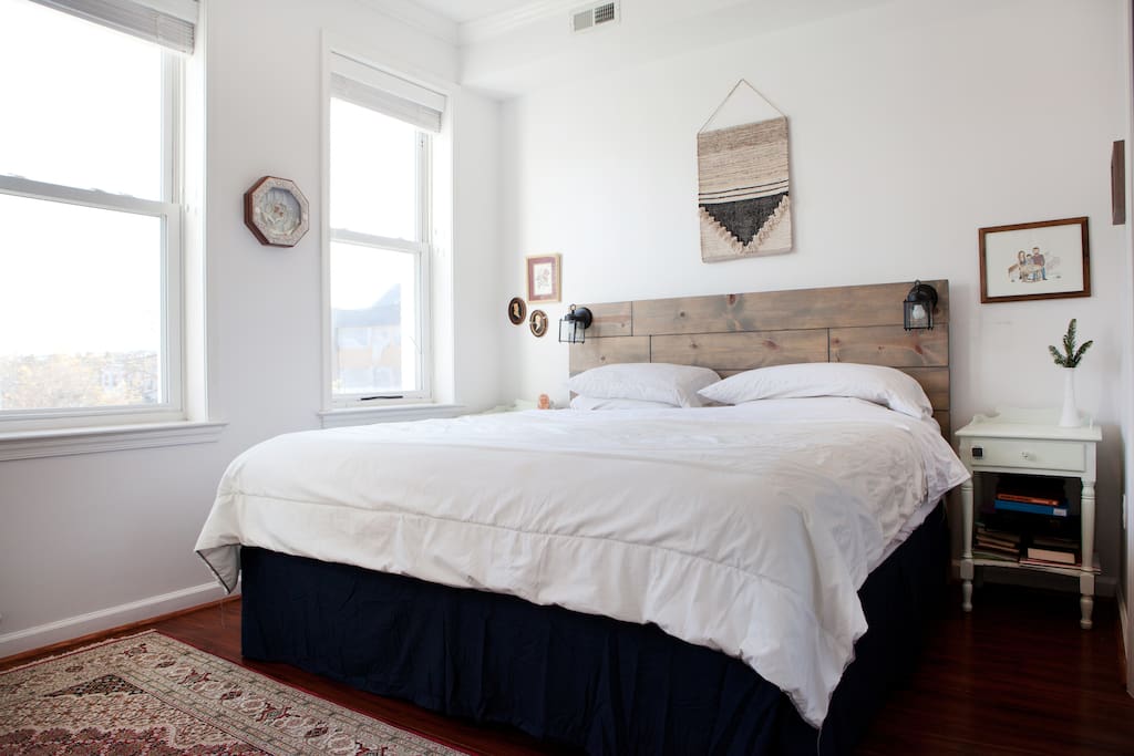 Master bedroom, east facing Windows, king size bed.