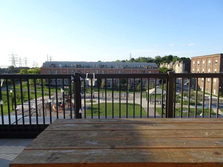 Rooftop patio view with large children's playground