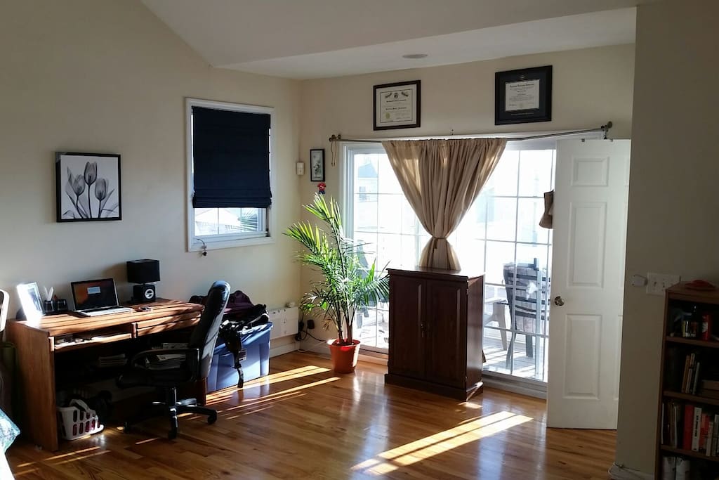 This is the bedroom as seen from the bathroom door. The door in the picture leads downstairs. If you are staying for a while please do me (and my plant) a favor and water the plant!