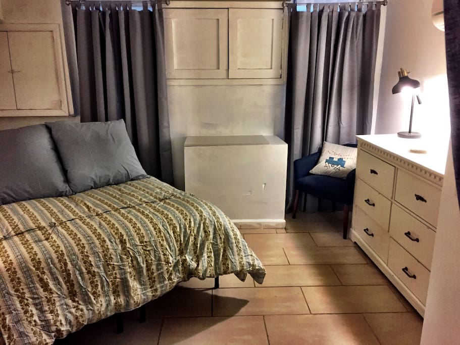 2 windows with thermal insulated, sound-proof black out drapes.