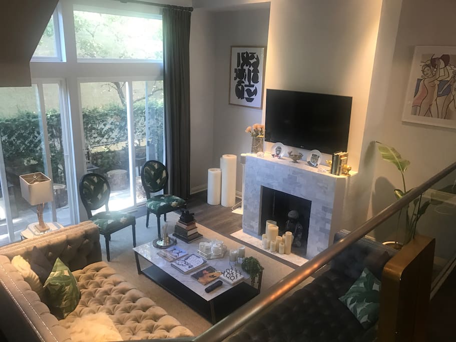 Living area with side patio and extra deep L couch good for 2 people to sleep on