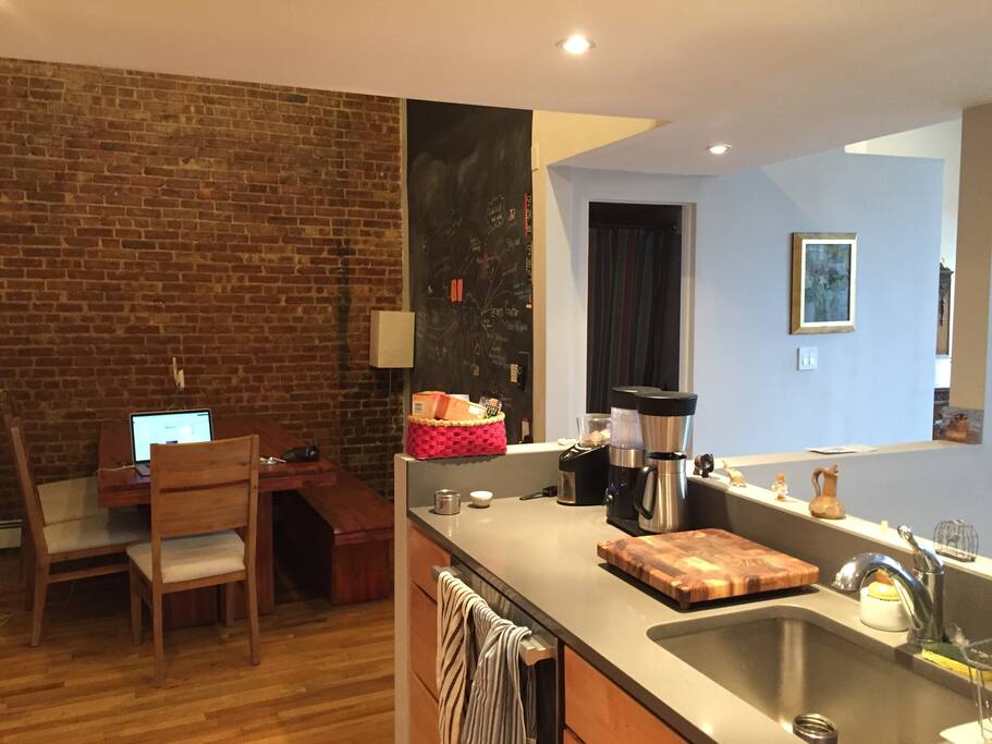 Open air kitchen that looks over dining room nook that seats 6-8.