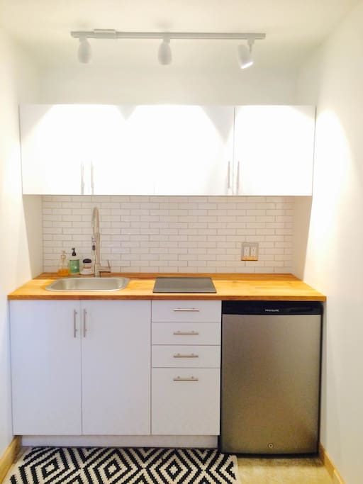 Fully Equipped Wet Bar with sink, mini fridge & freezer, and Keurig Coffee maker.