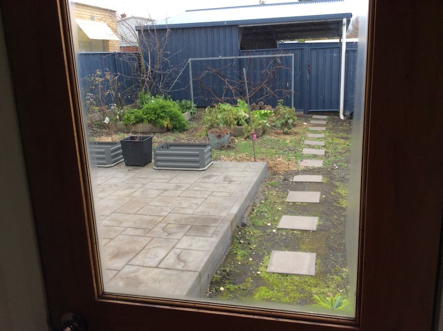 Back yard dog proof, vegetable patch and sunroom with BBQ