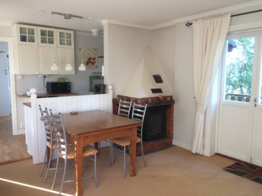 Living room to kitchen with fireplace.