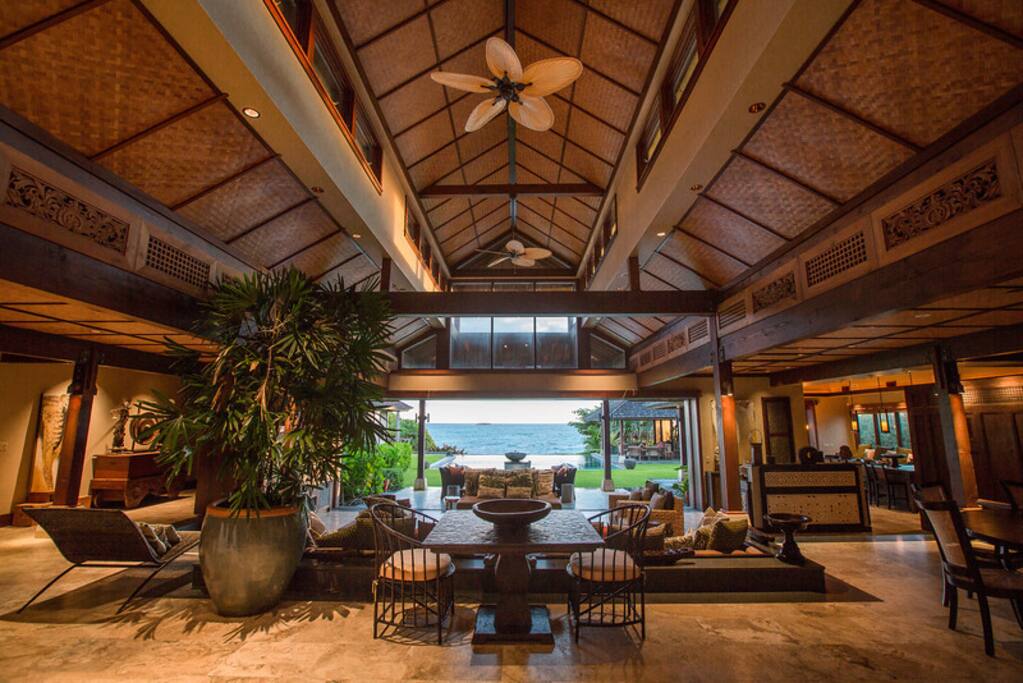 Elegant fans carry in the ocean breezes, and the home is fully air-conditioned as well.