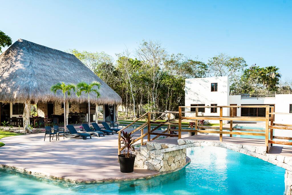Private palapa with swimming pool running in to it!