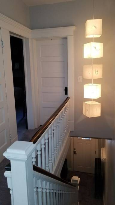 Room is directly at the top of the stairs, has brass doorknob