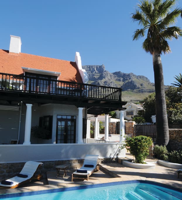 The warmth and atmosphere the house radiates is second to none. You will feel so at ease and peaceful with the house's dated yellow wooden floors and ceilings, and its fire places. It feels like Table Mountain is in your back yard.